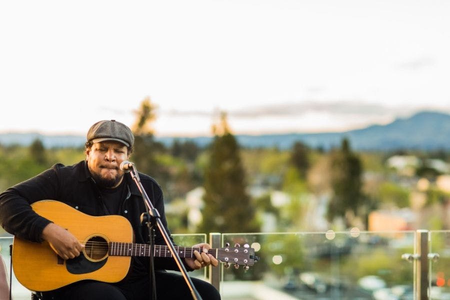 Chris Pierce holding a guitar