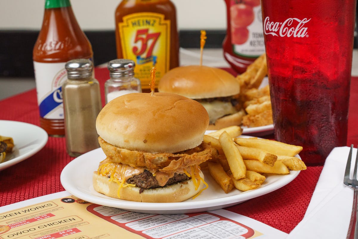 a table topped with a sandwich and fries on a plate