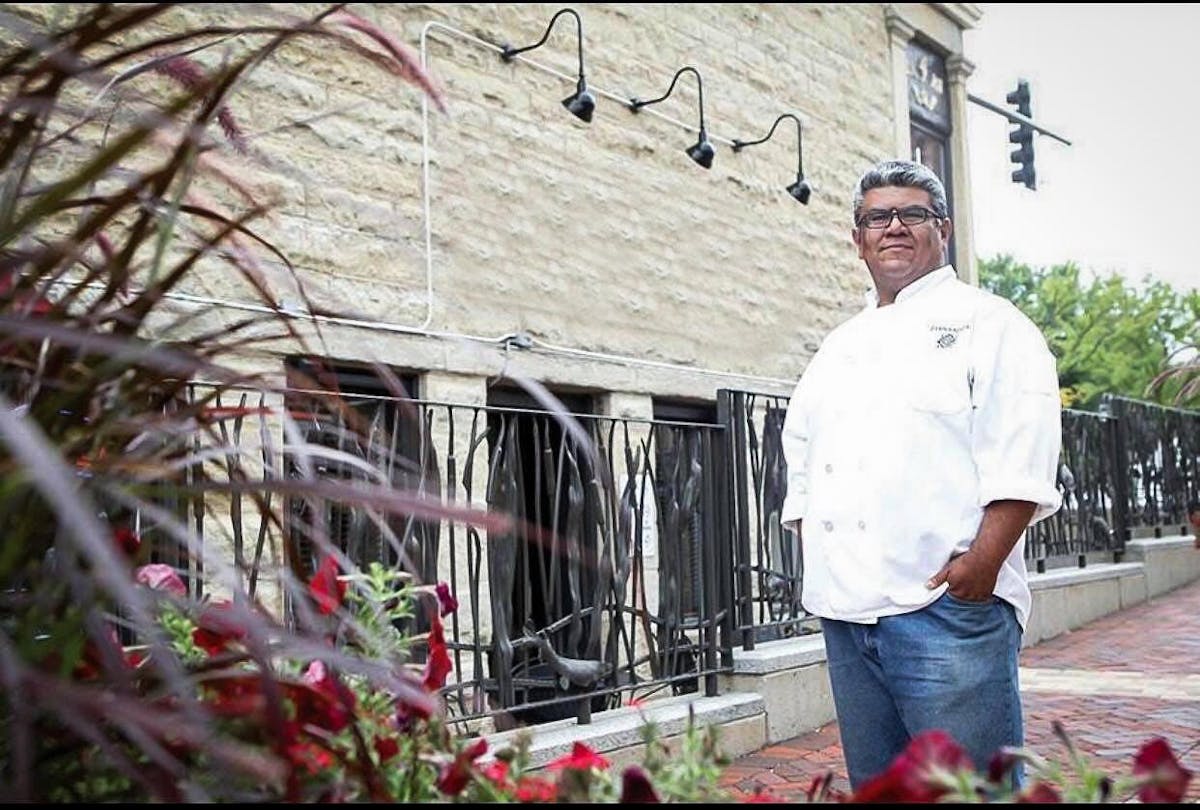 a man standing in front of a building