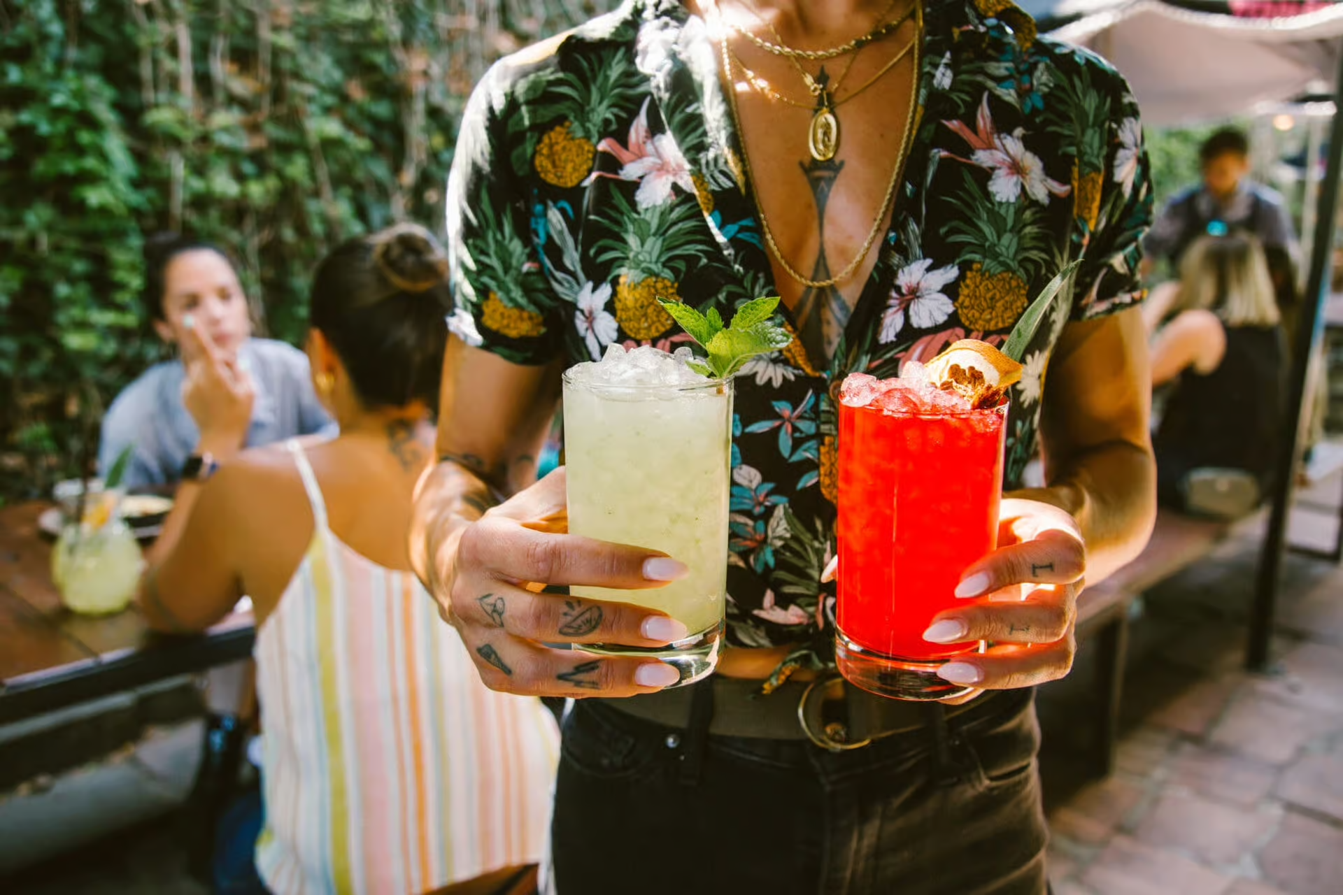 a group of people sitting at a table with food