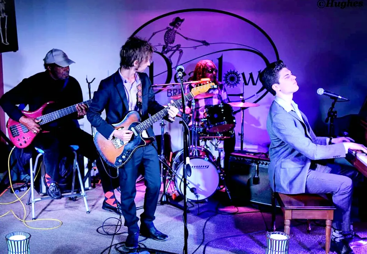 The Riverfront Room at Dead Low Brewingup of people playing instruments on a stage