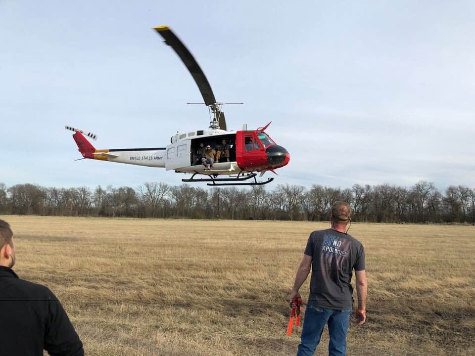 a man flying a kite in a field