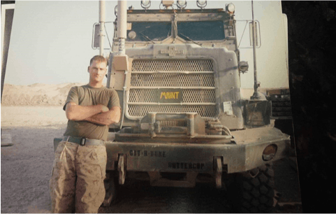 a man standing in front of a vehicle