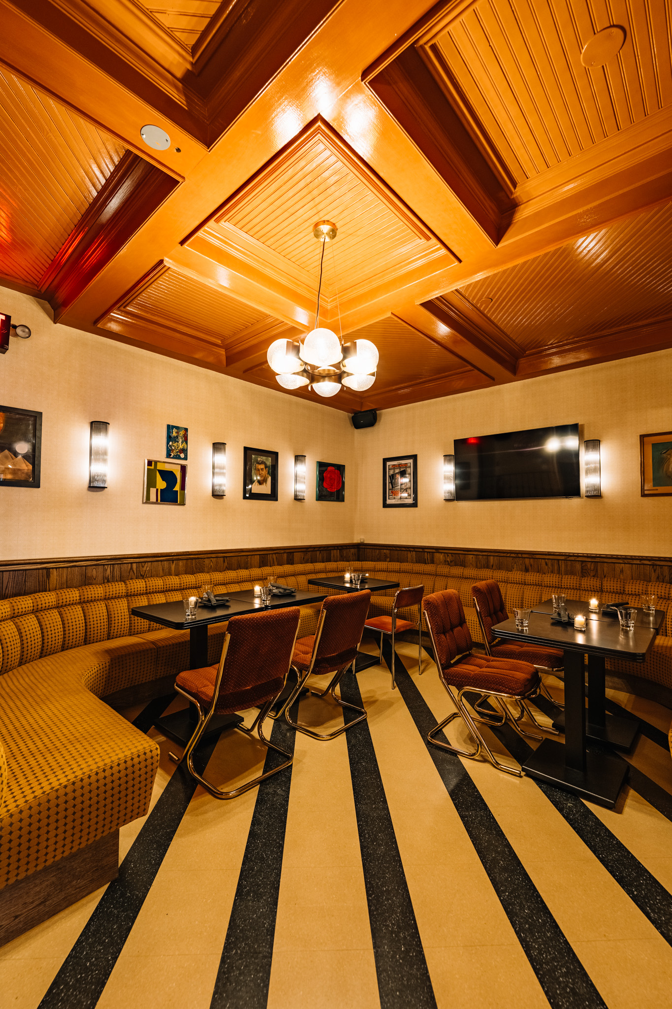 Warm, intimate dining room with leather banquette