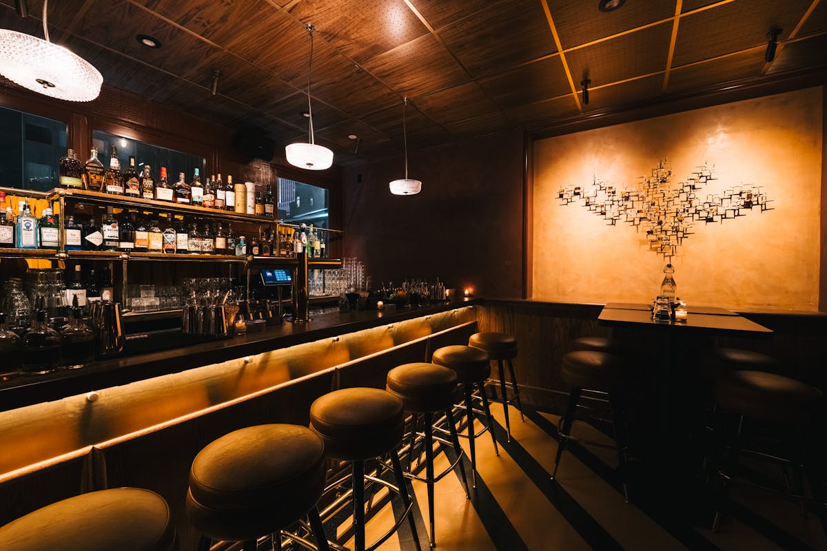 Well-arranged bar interior captured from the entrance
