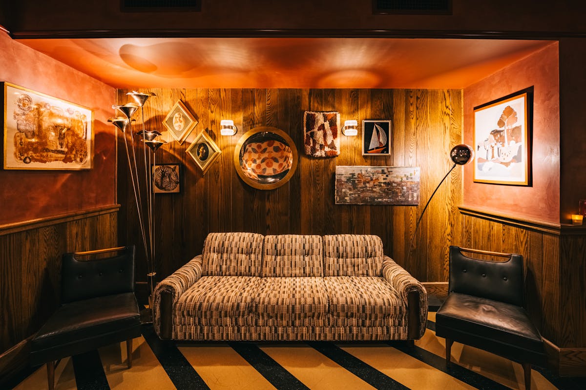 Intimate lounge-style bar with golden curtains