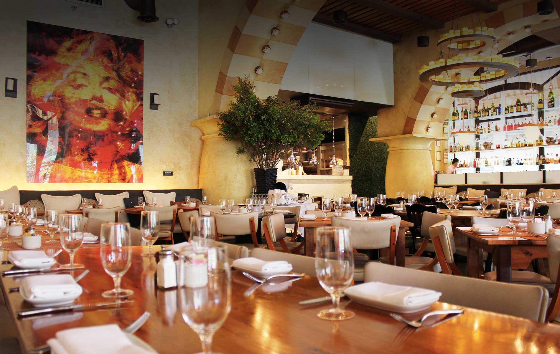 a group of people sitting at a table with wine glasses