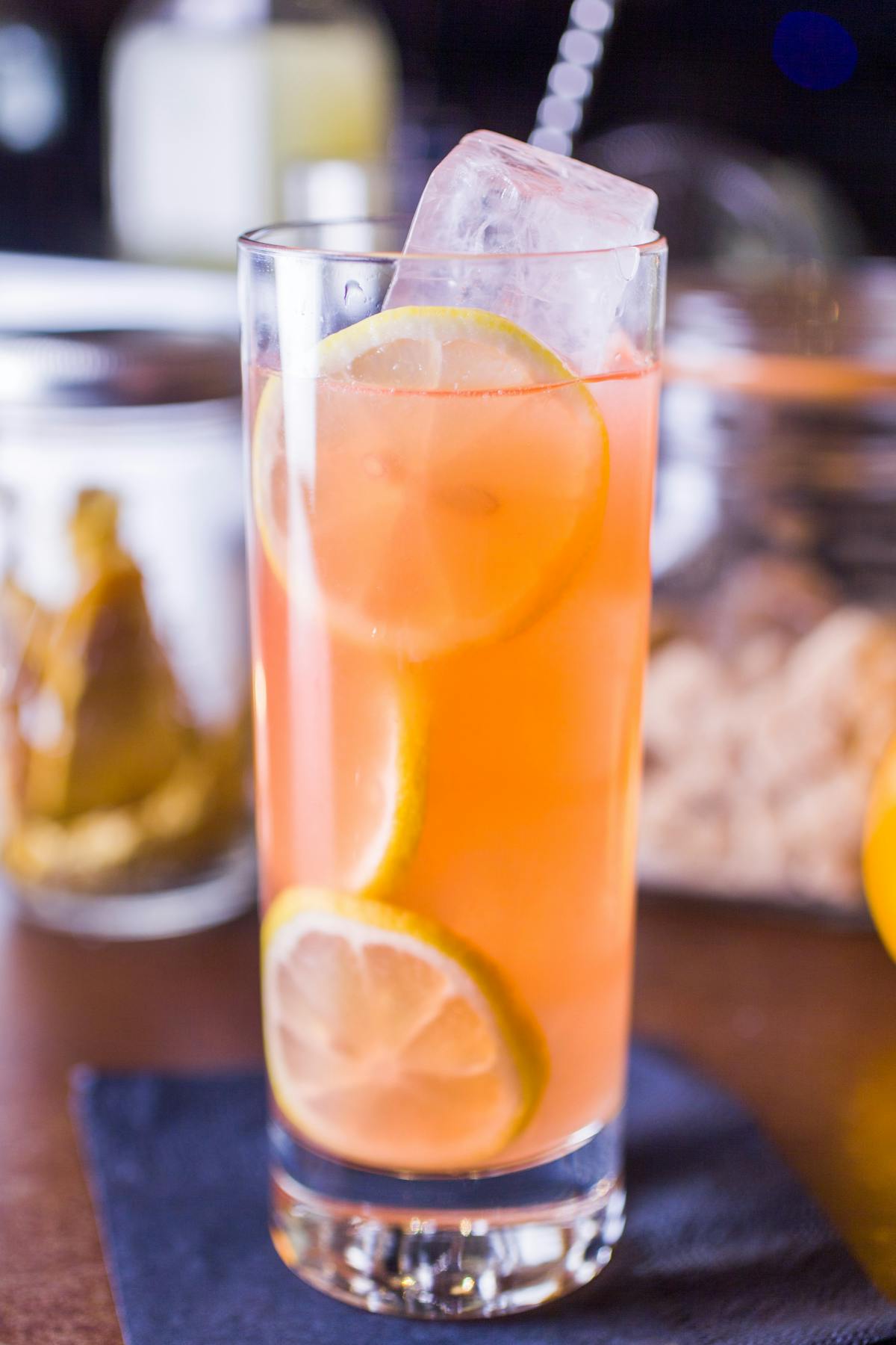 a close up of a glass of orange juice