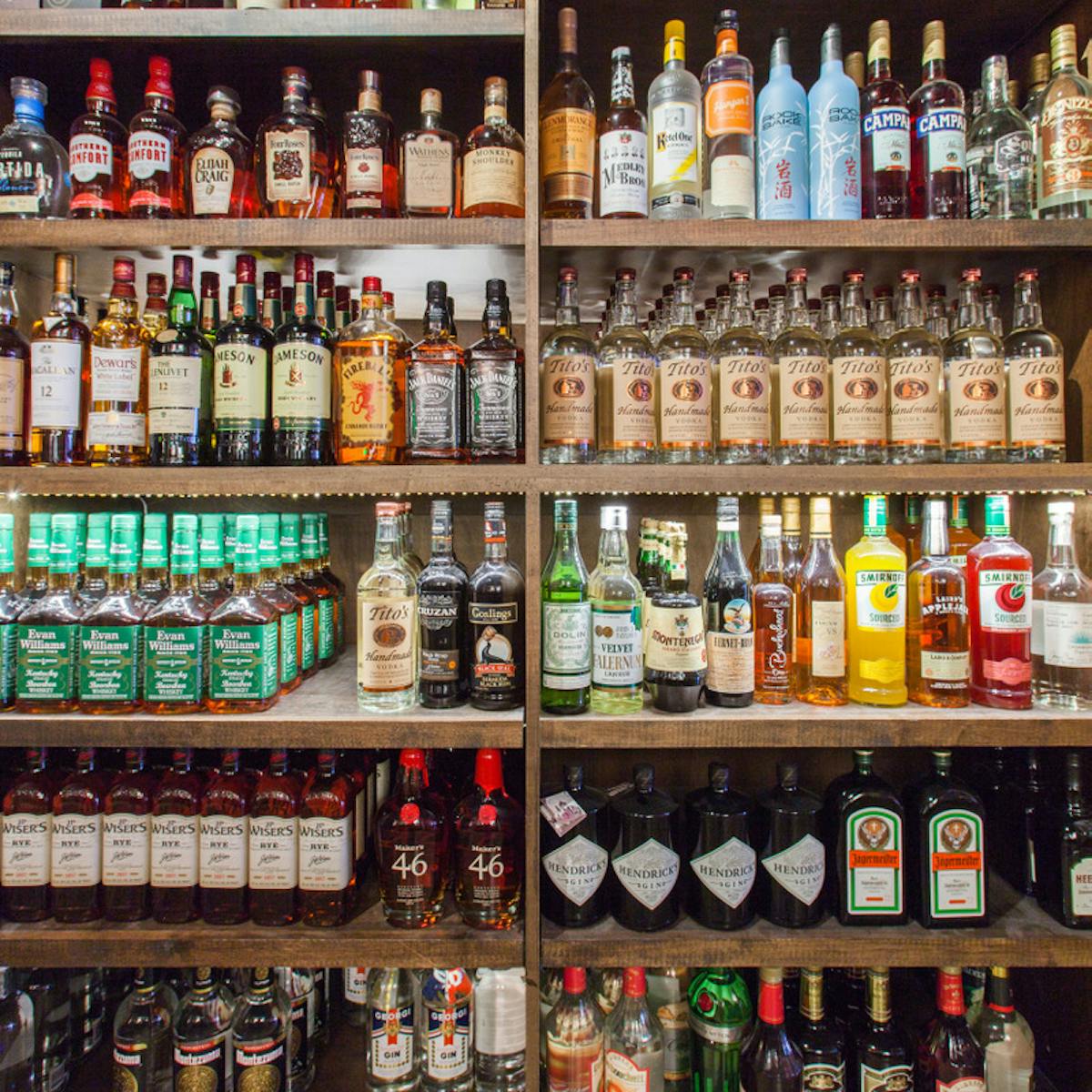 a store shelf filled with wine glasses