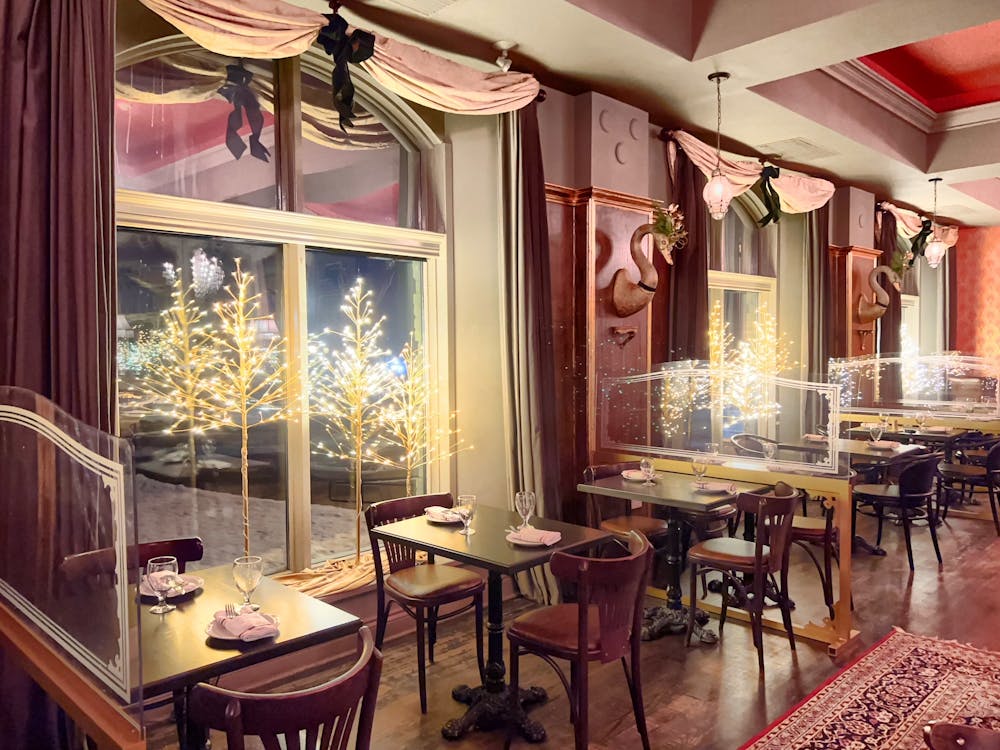 a dining room table in front of a window