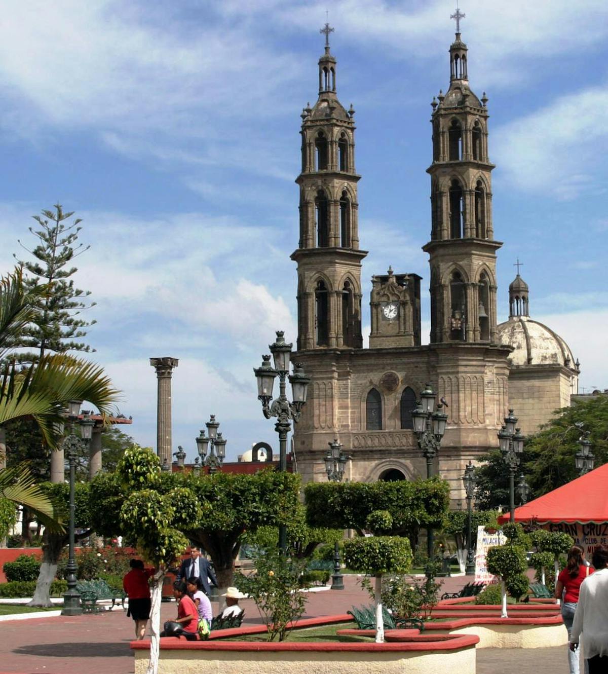 a group of people walking in front of a church