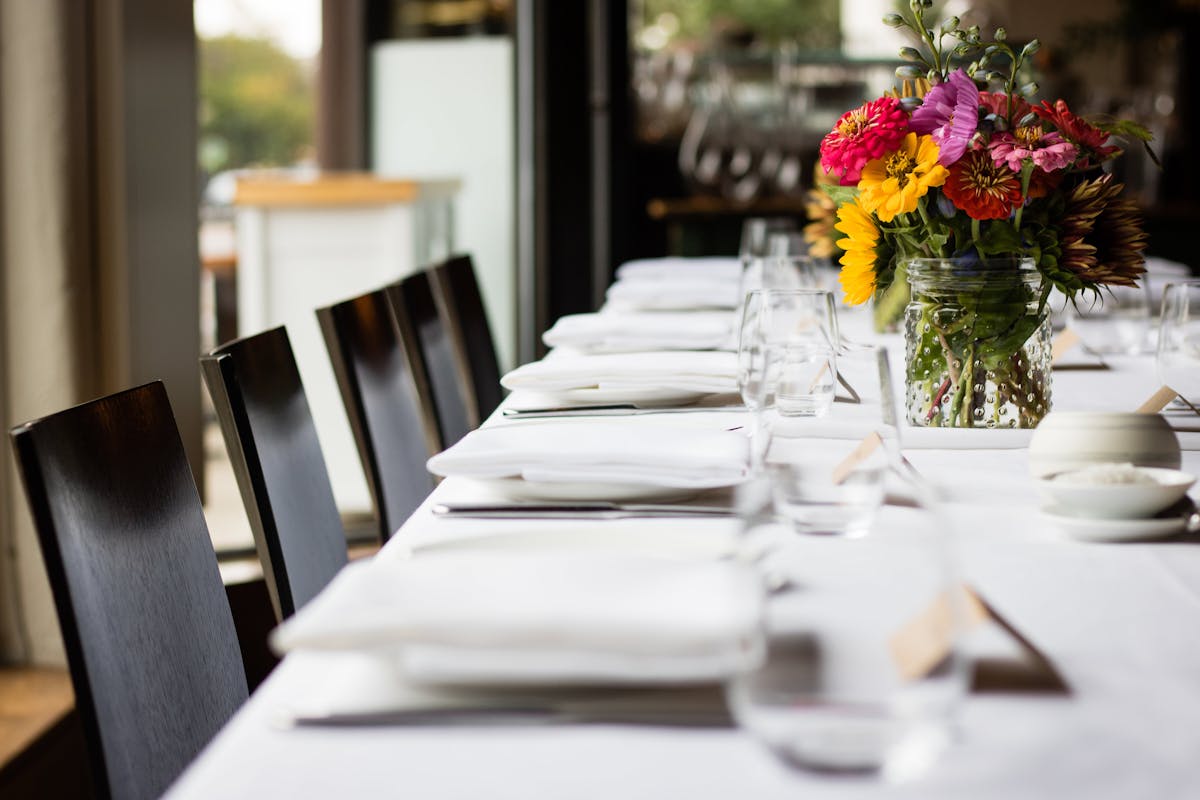 a close up of a large table filled with cups and plates