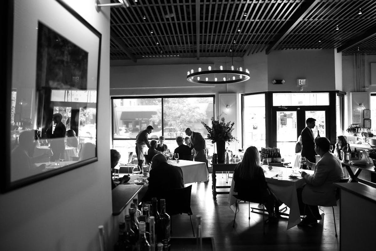 a group of people in a dining room