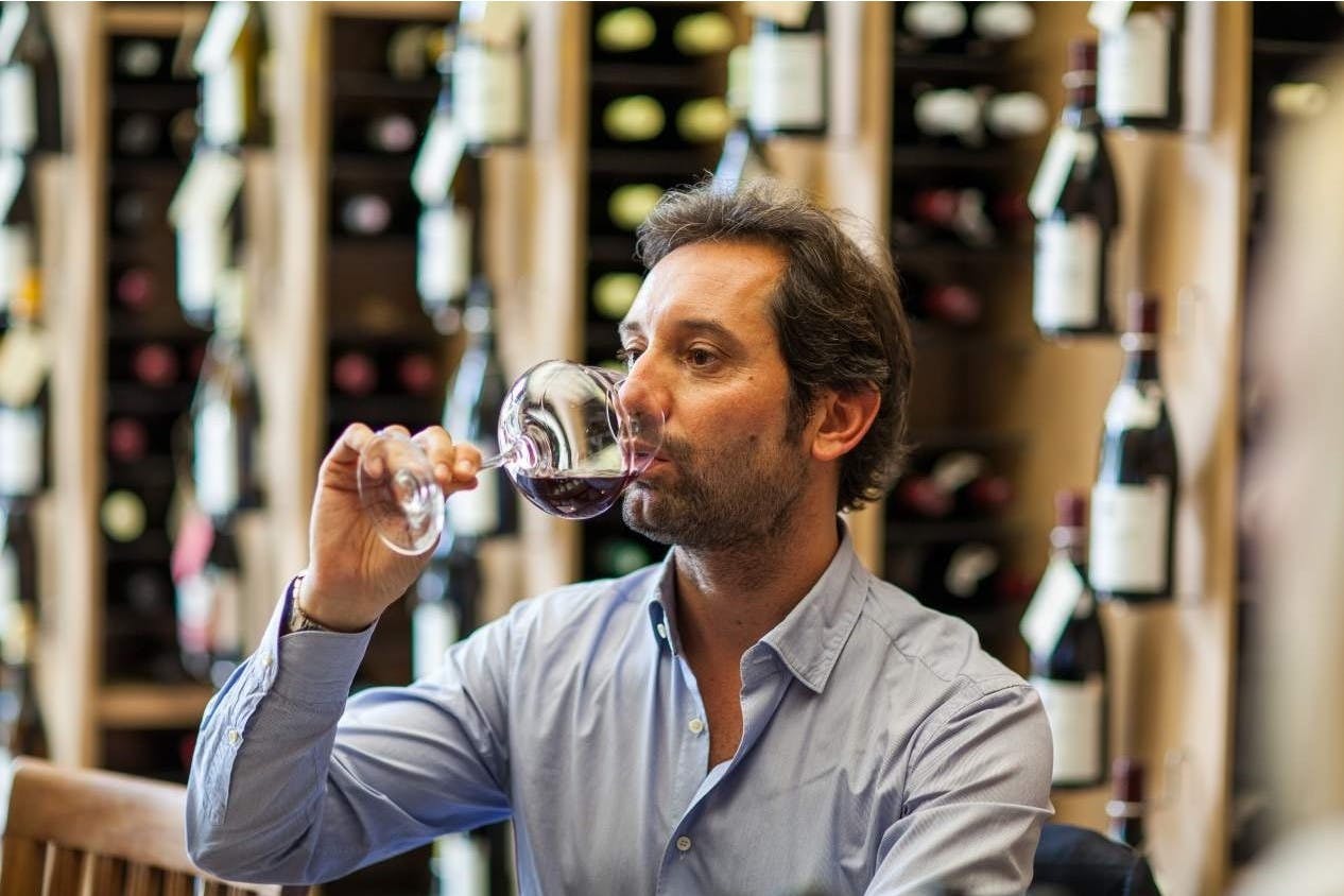 Antonio V. Benanti drinking from a glass