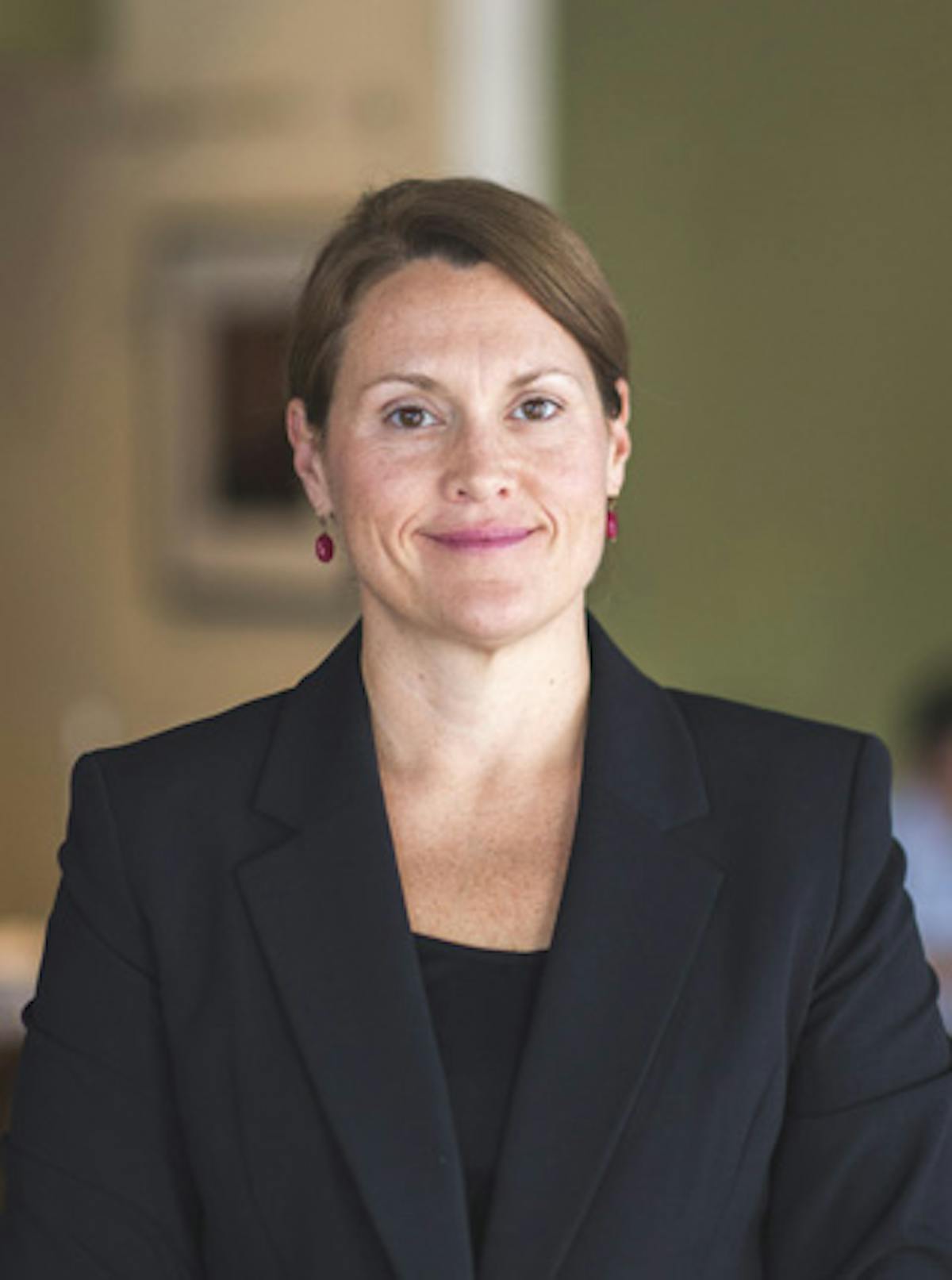 a woman in a tuxedo posing for the camera