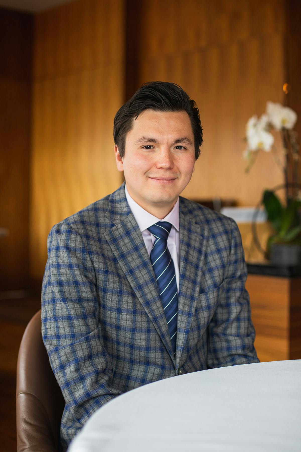 a man standing in front of a table