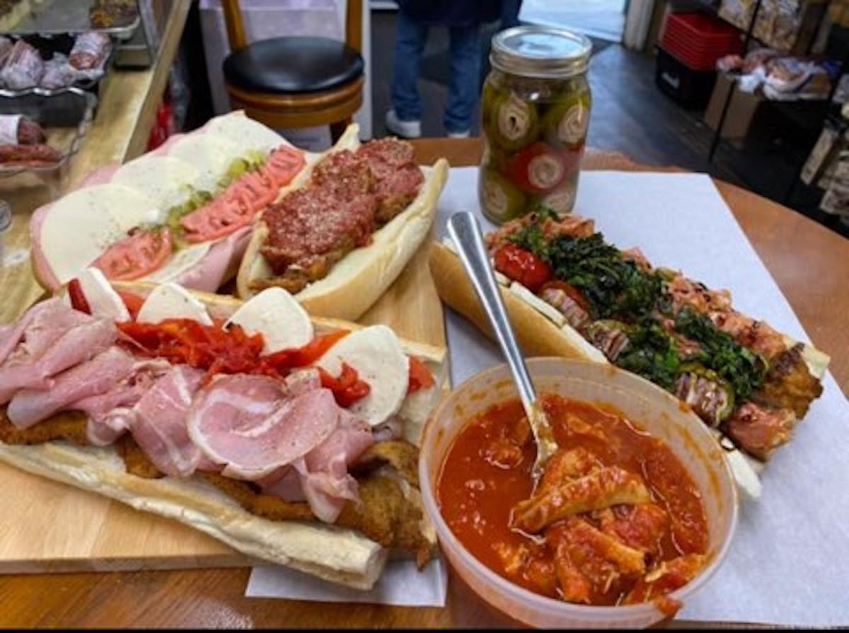 a sandwich sitting on top of a wooden table