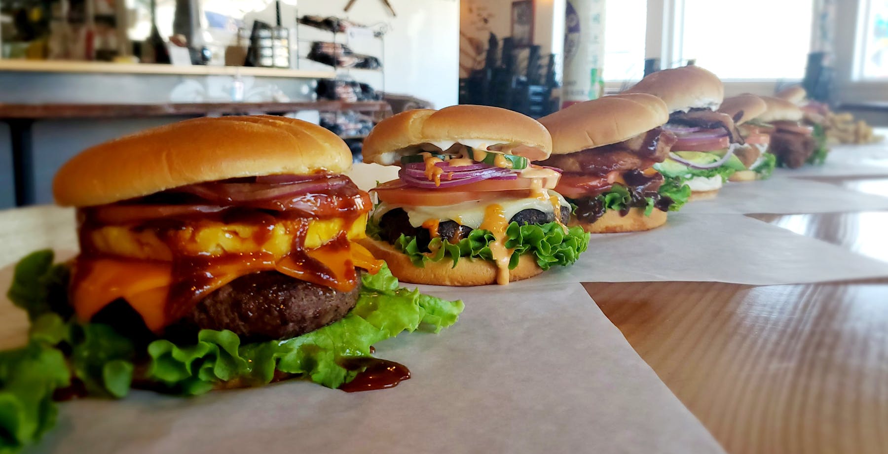 a close up of a sandwich sitting on top of a wooden table
