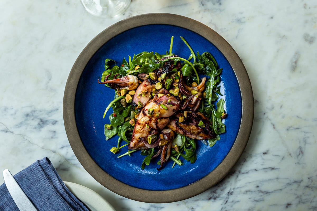 a bowl of food with broccoli