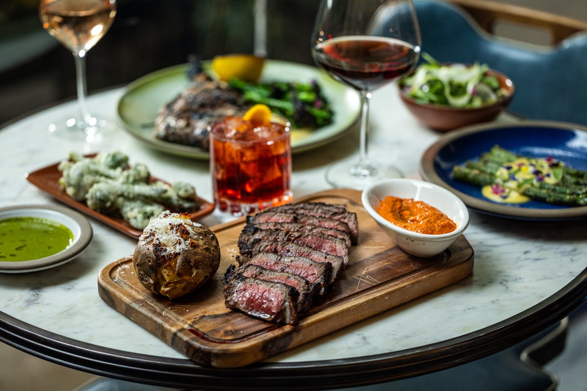 a plate of food and a glass of wine