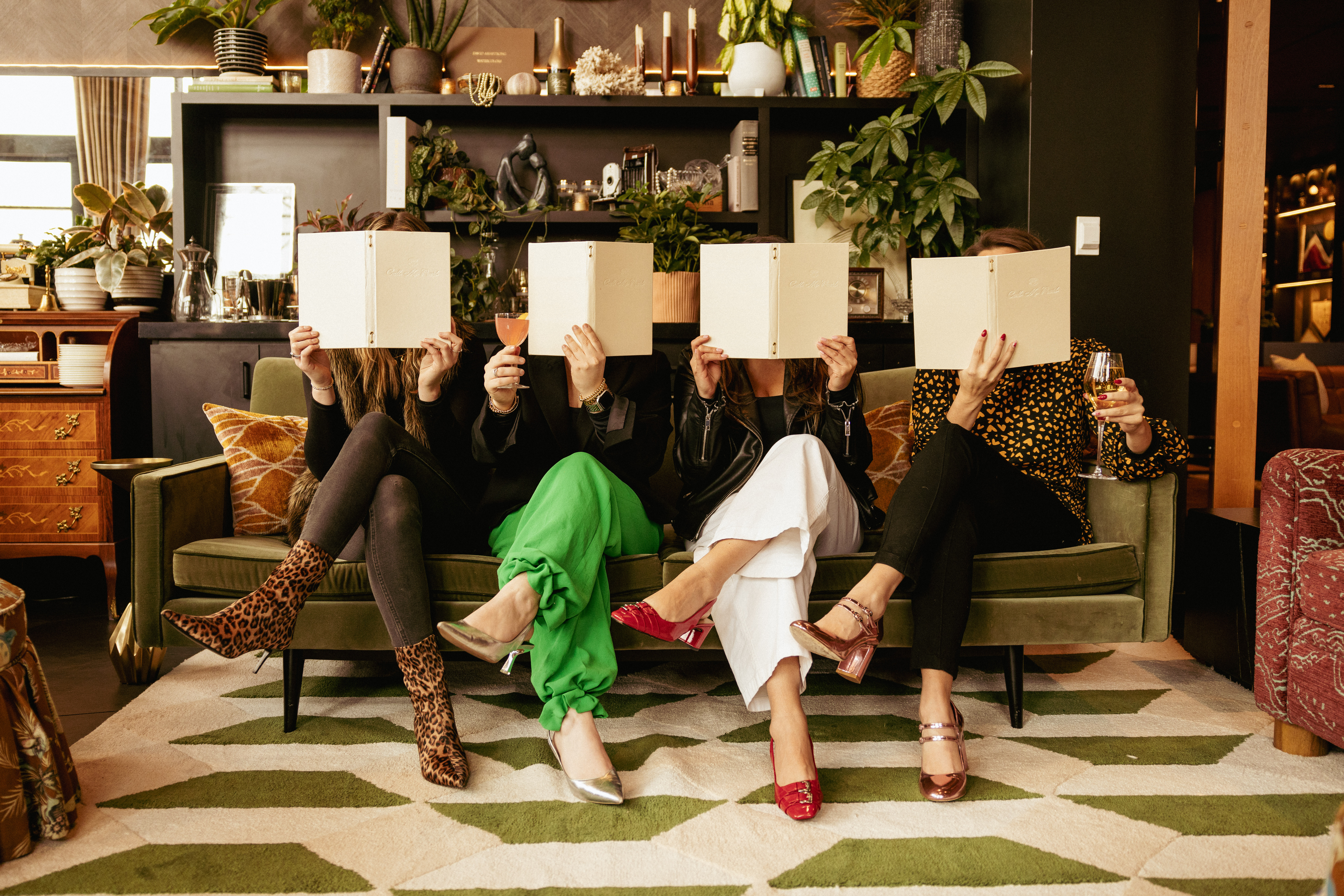 a group of people looking at a menu
