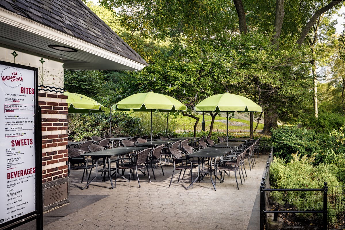 a patio with green umbrellas
