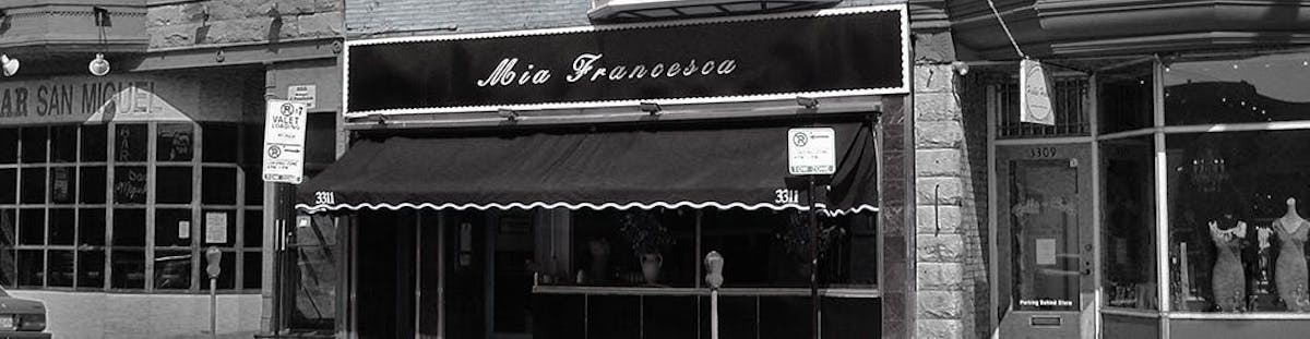 a sign on an awning on the side of a building