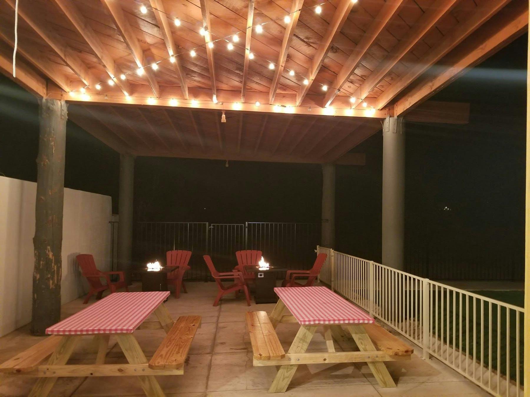 an opened dining area with tables and chairs