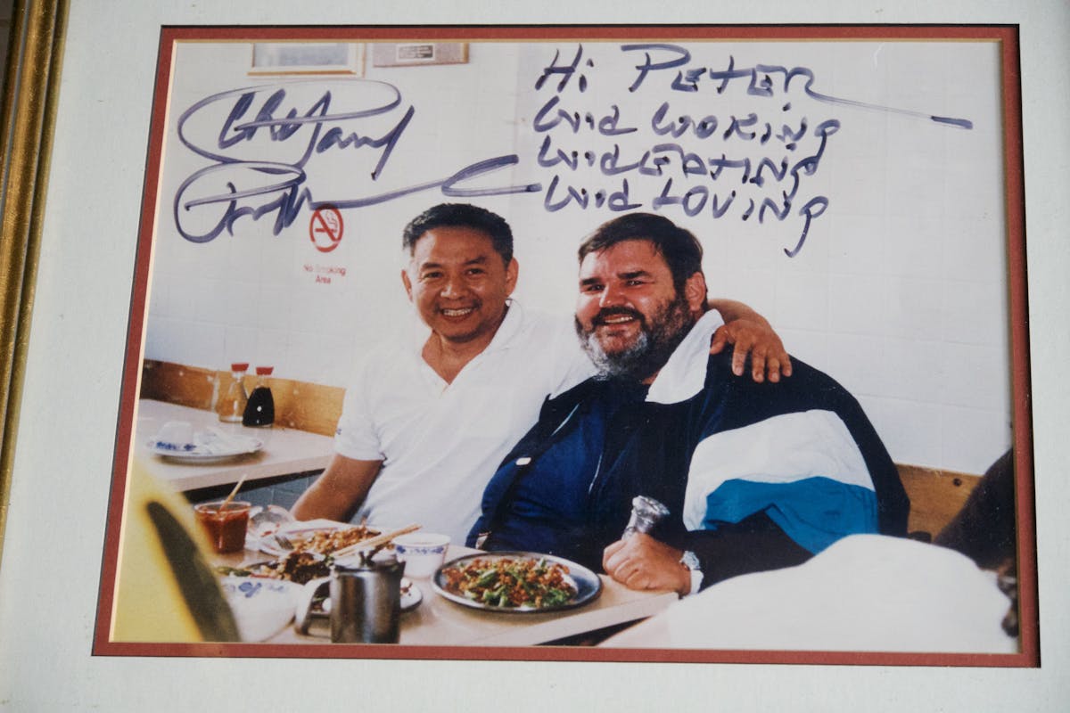 Paul Prudhomme holding a sign