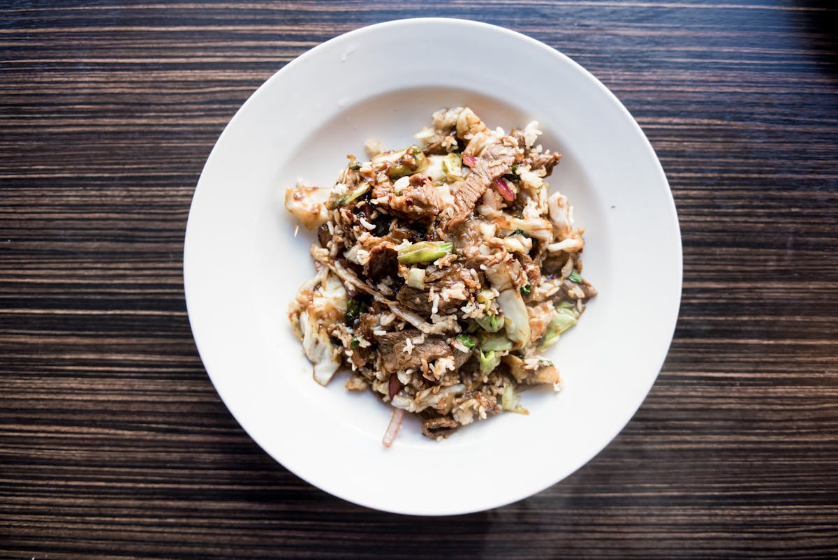 a plate of food on a wooden table