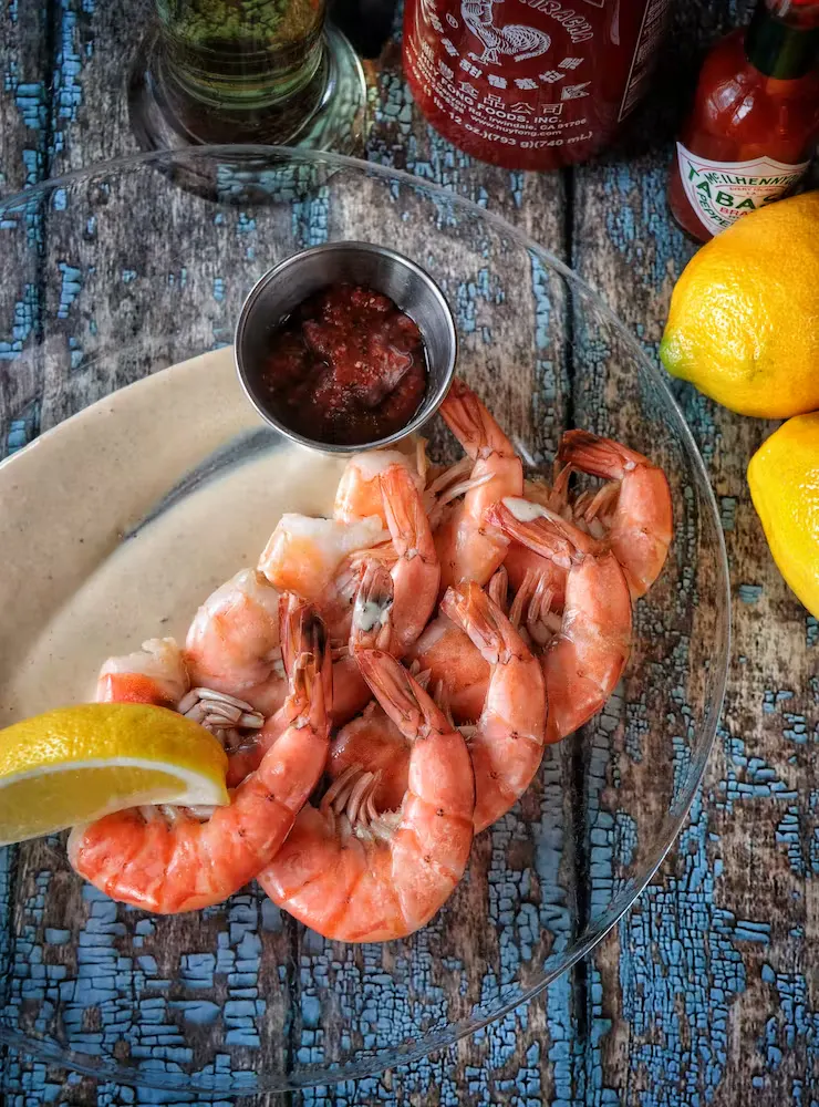 a bowl of oranges on a table