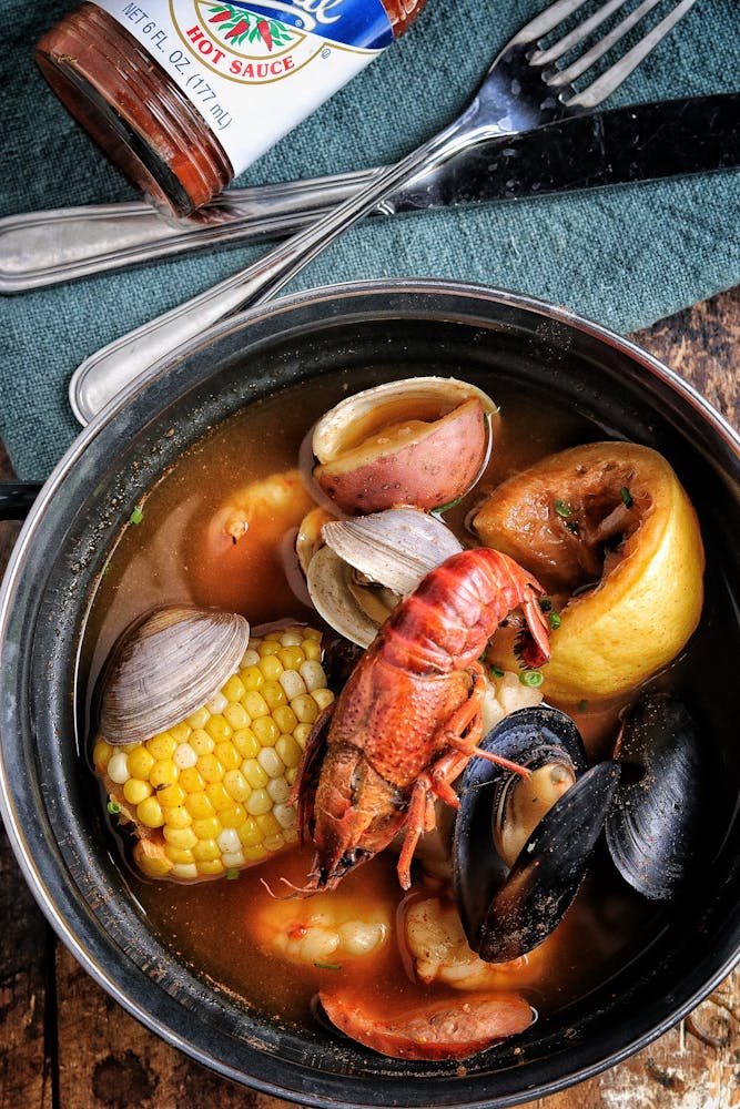 a white plate topped with meat and vegetables