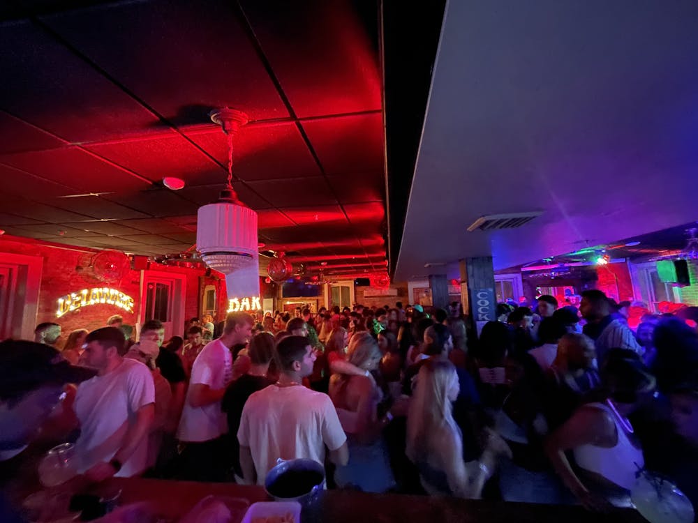 a group of people on a stage in front of a crowd