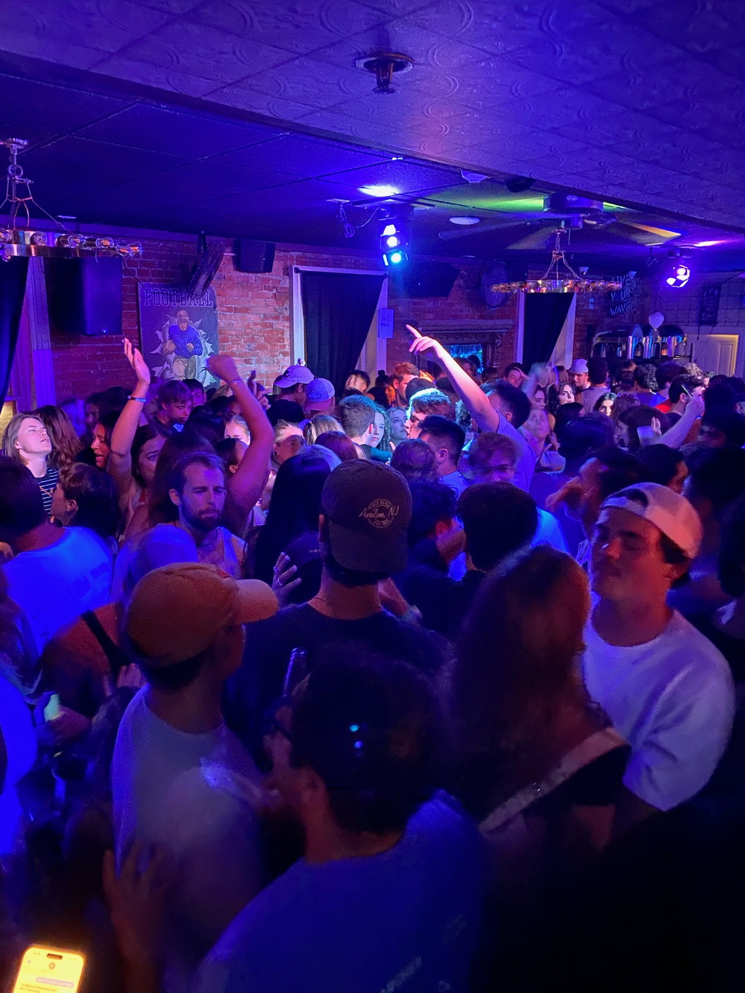 a group of people on a stage in front of a crowd