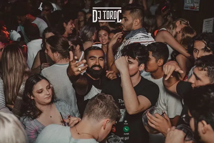 a group of people standing in front of a crowd