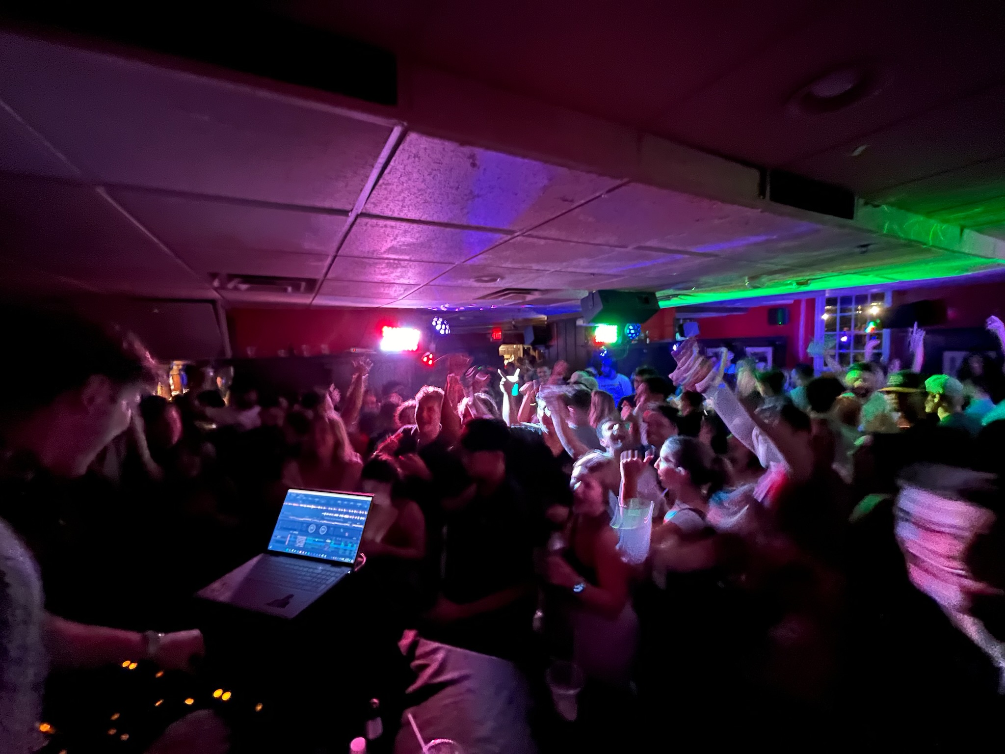 a group of people standing on a stage in front of a crowd
