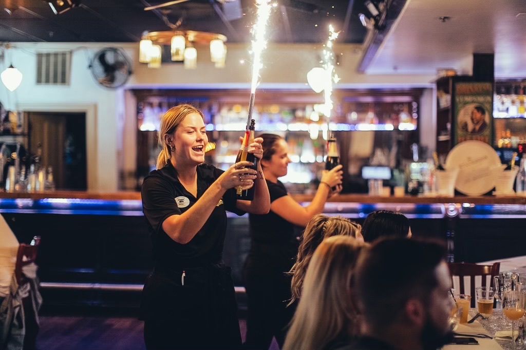 a person standing in front of a restaurant