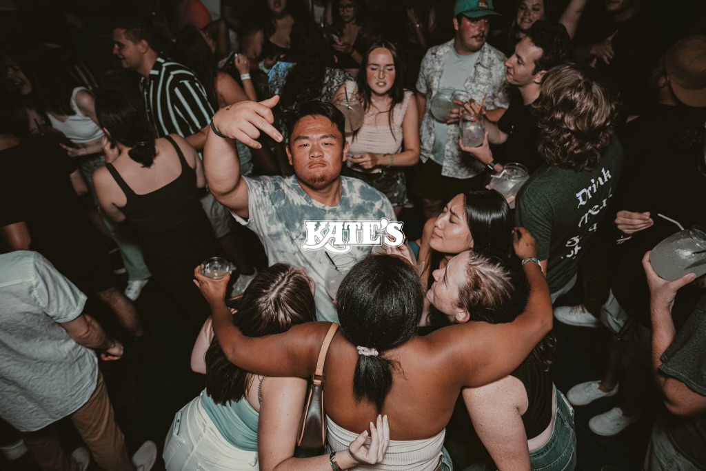 a group of people standing in front of a crowd