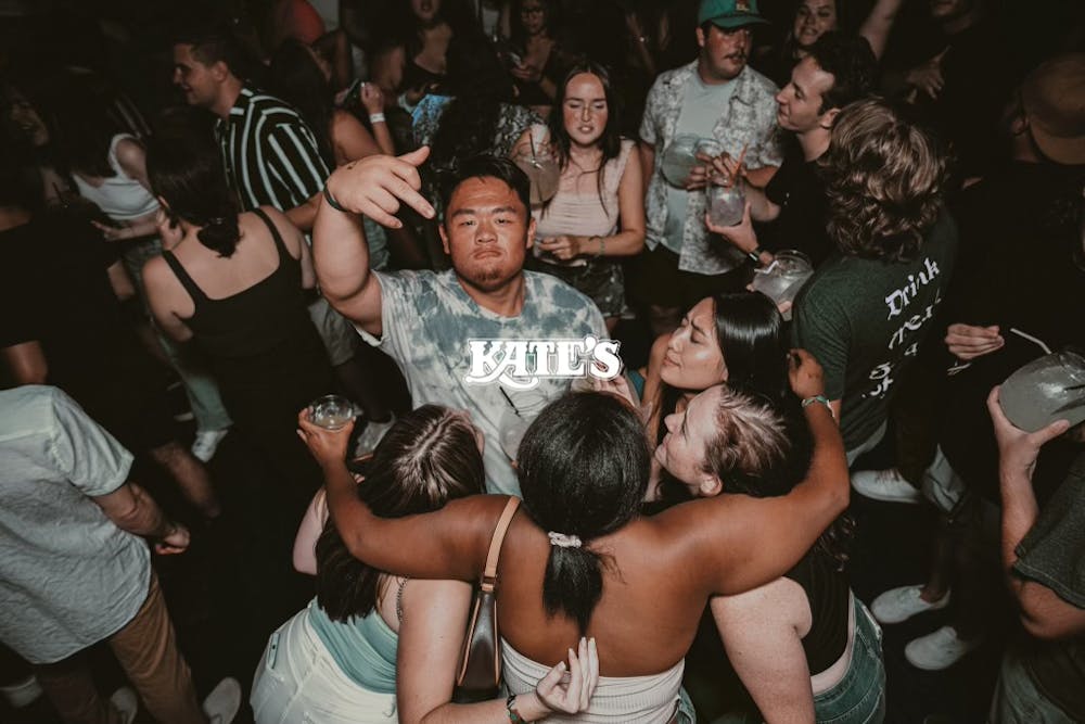 a group of people standing in front of a crowd