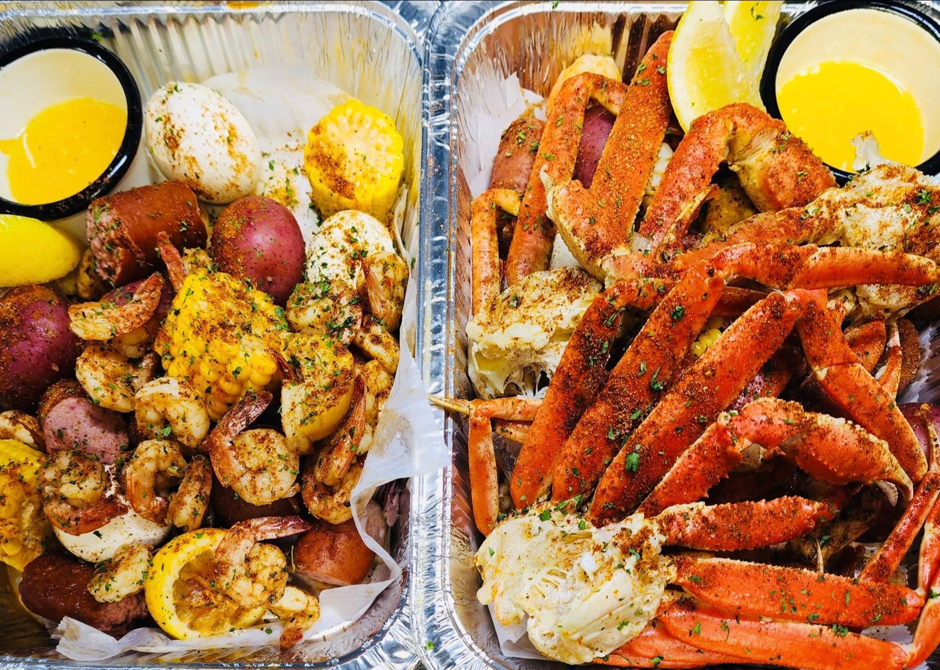a trays of seafood with a variety of food