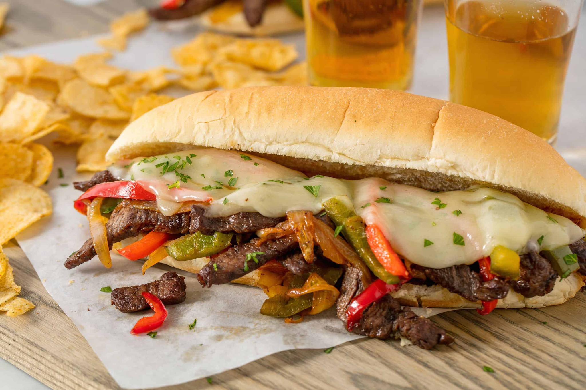a sandwich with meat and vegetables on a table