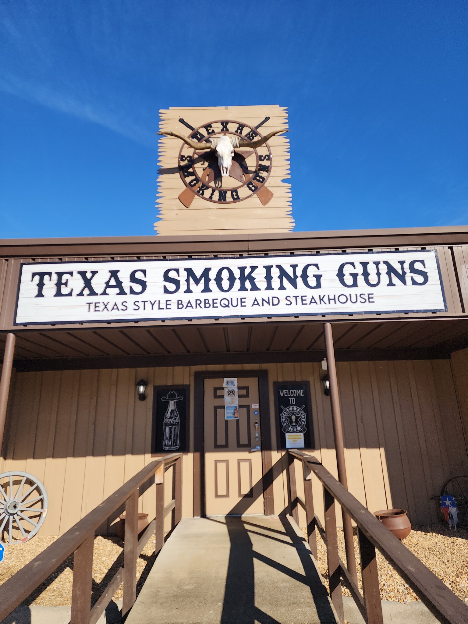 a building with a sign and a clock on it