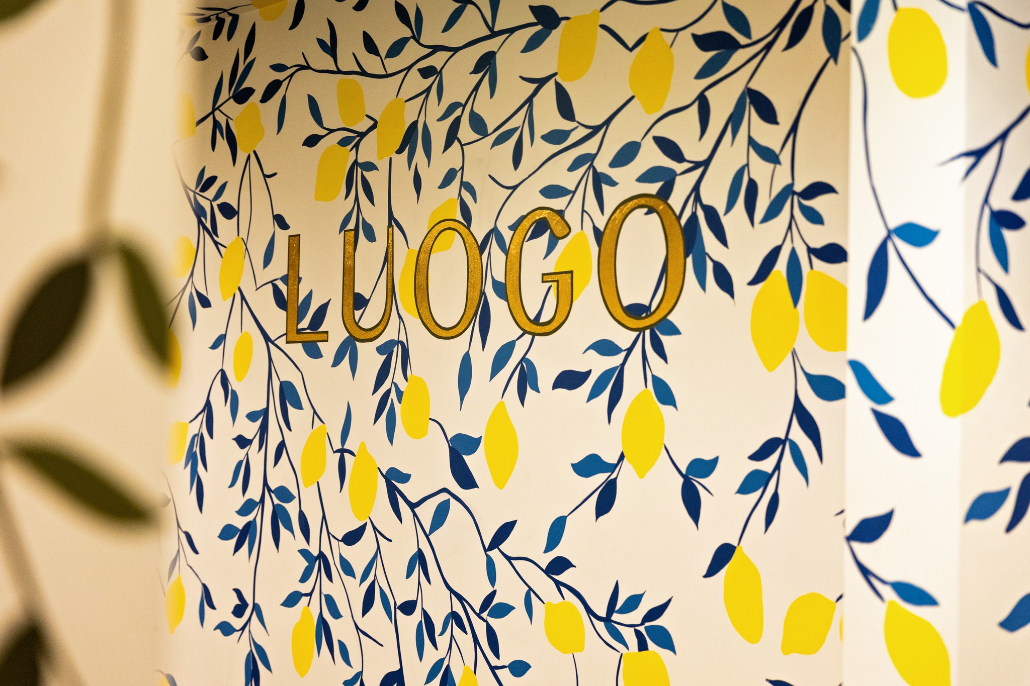 wall with lemons and a logo