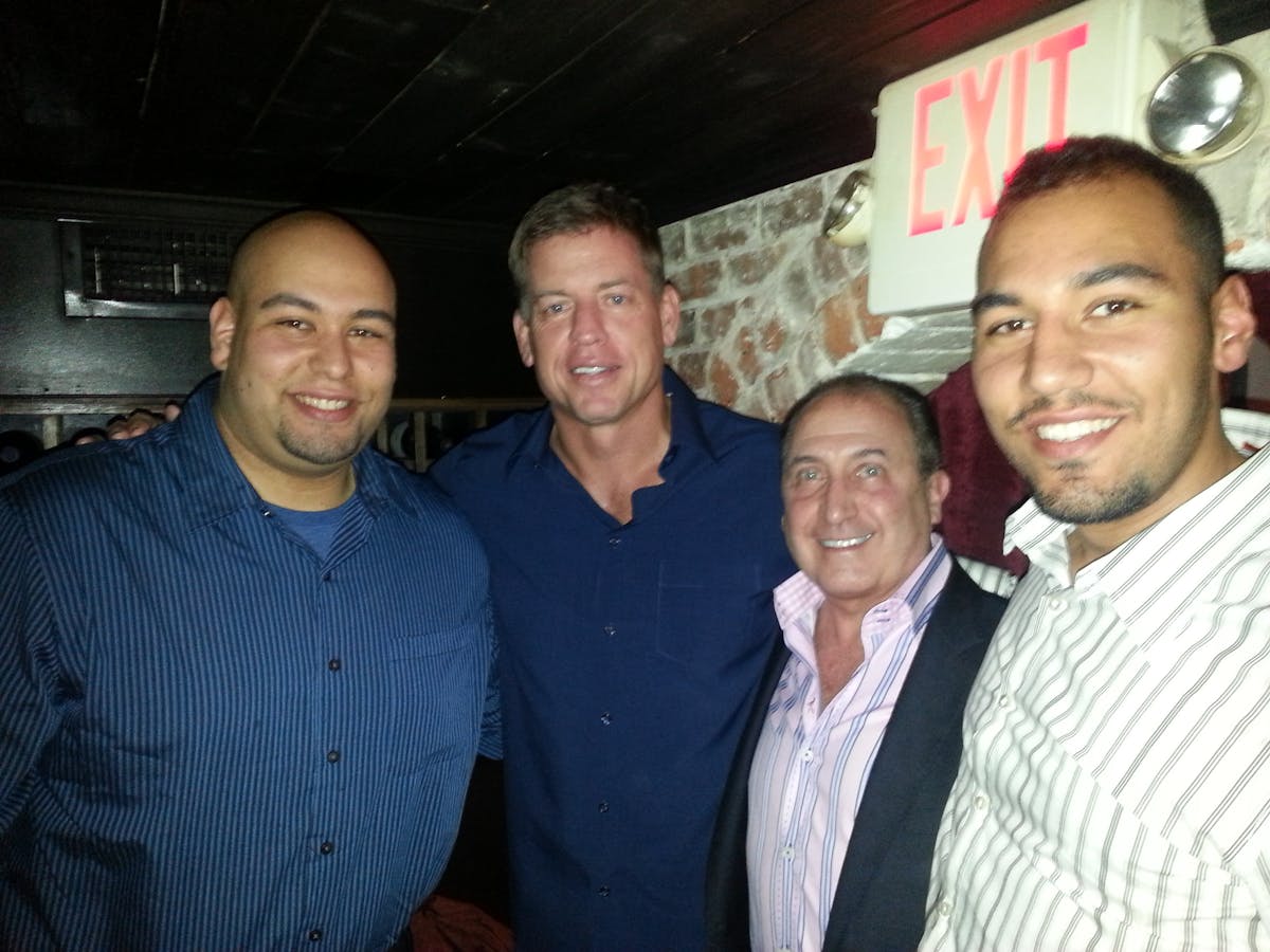 Troy Aikman et al. posing for the camera