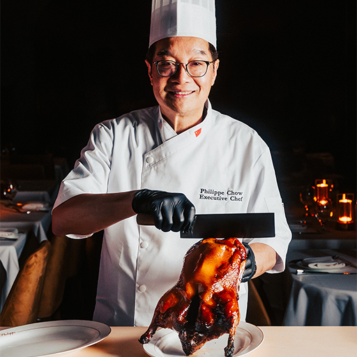 Chef Philippe Chow carving signature Peking Duck