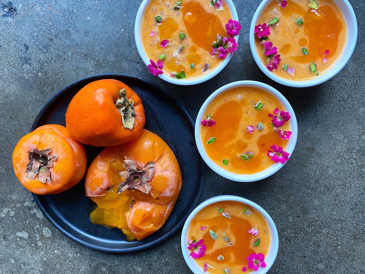 a bowl of oranges on a plate