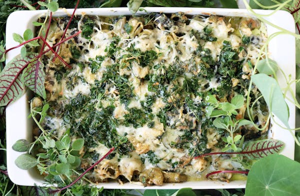 a pizza with cheese and broccoli