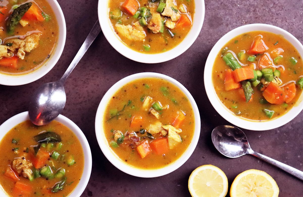 a bowl filled with different types of food on a table