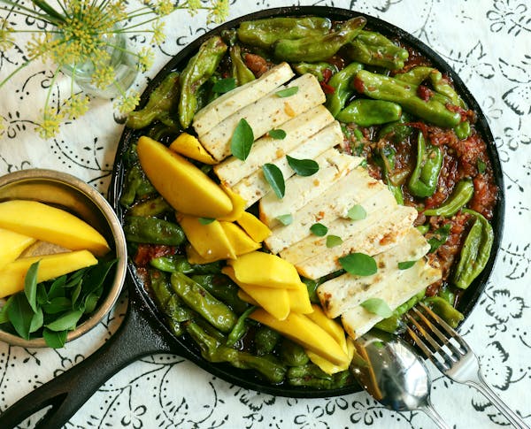 a plate of food with a green salad