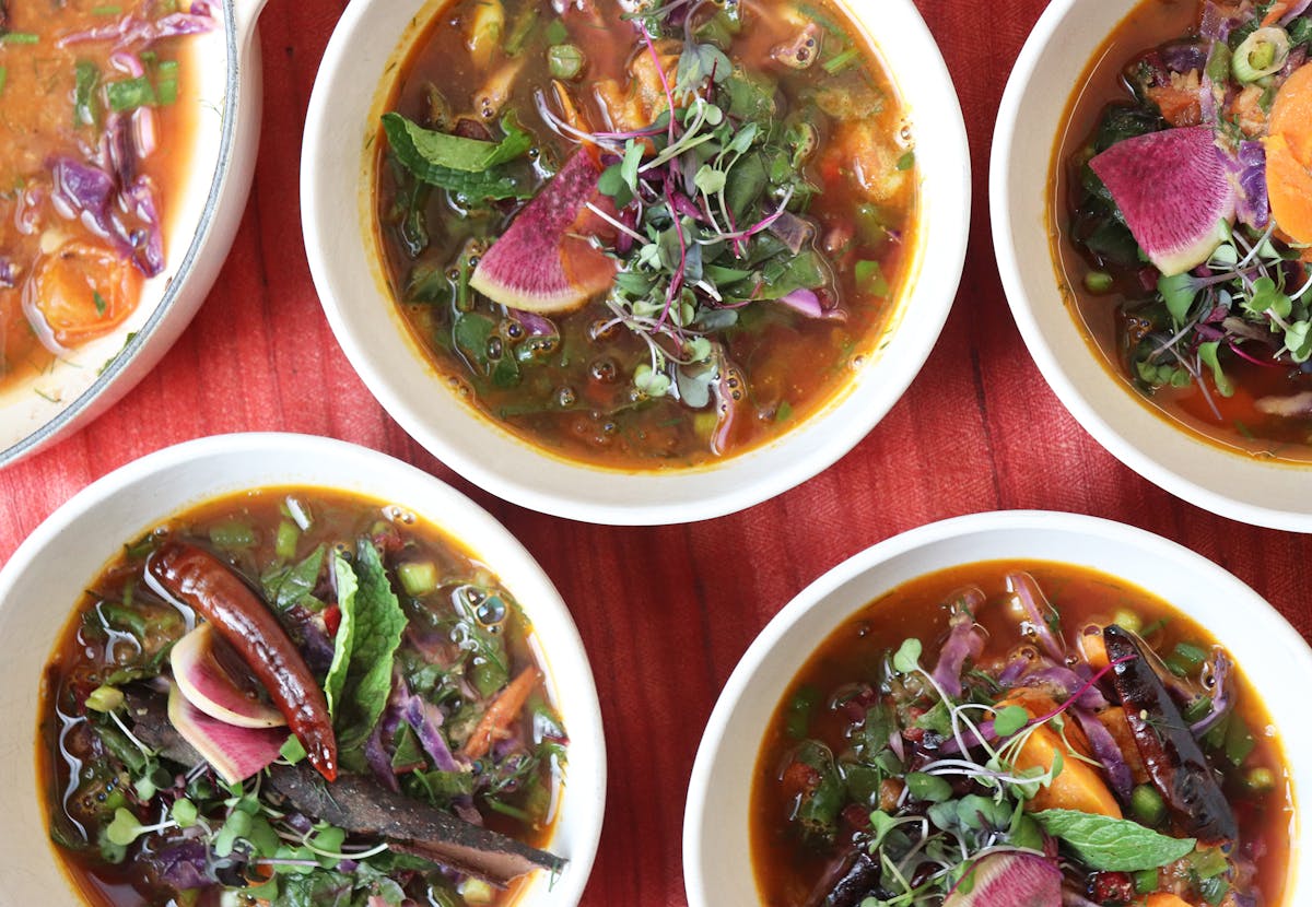 a bowl filled with different types of food on a table